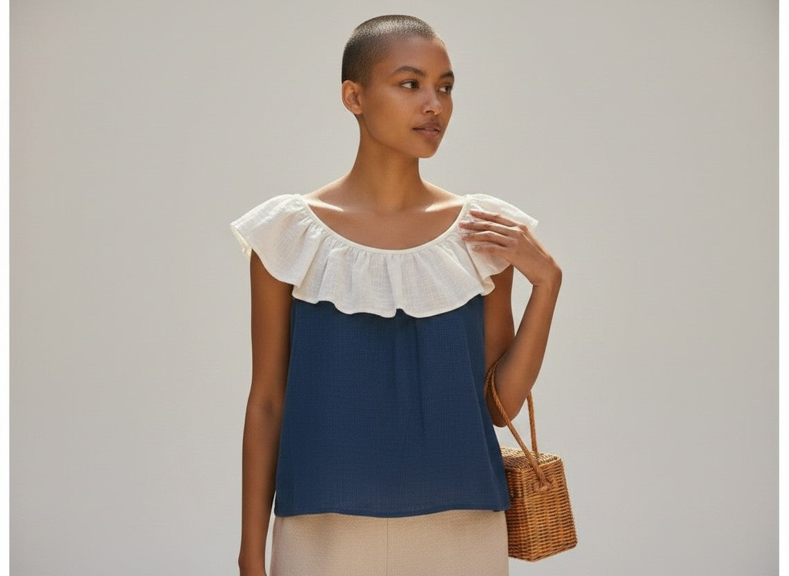The Round Rack navy and cream linen sleeveless top with ruffle collar, size XS.