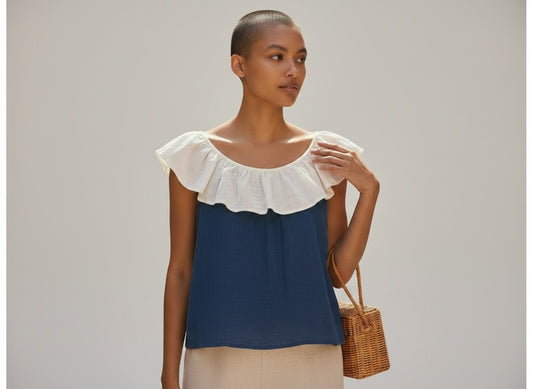 The Round Rack navy and cream linen sleeveless top with ruffle collar, size XS.